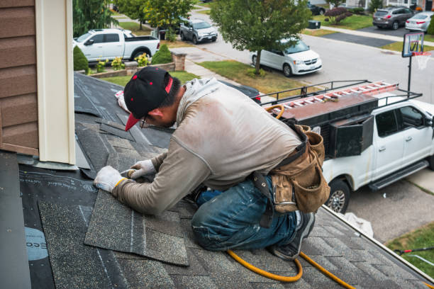 Professional Roof Repair technician working in Malaga, OH